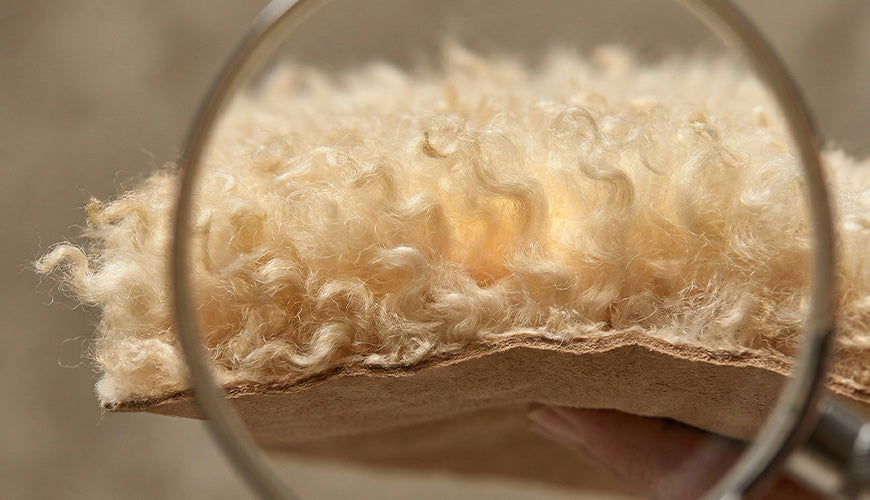 Natural sheepskin insulation showing wool fibres, air pockets and breathable structure that creates warmth